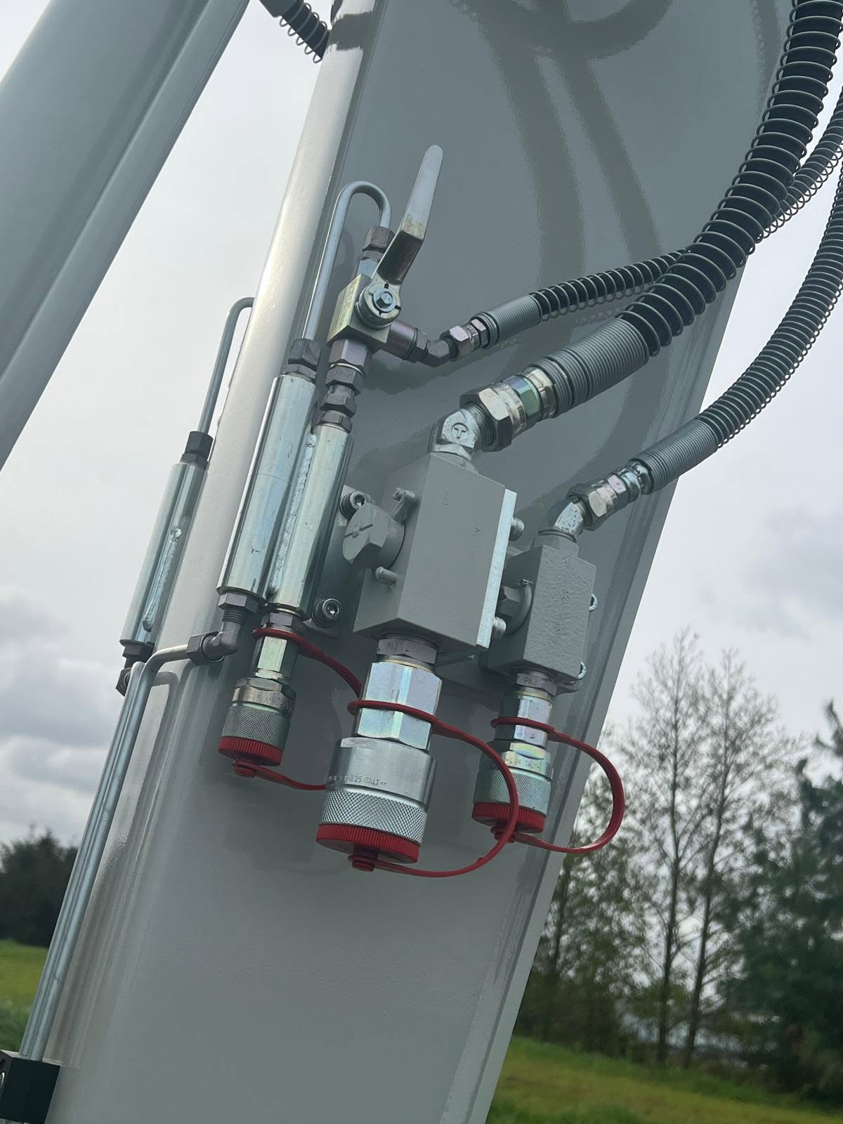 Maaikorffunctie op de giek van een Takeuchi graafmachine