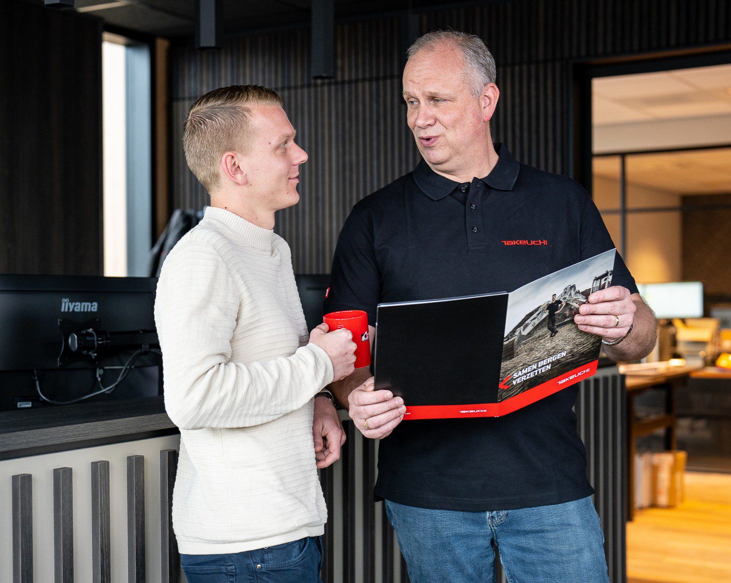 Takeuchi klant met vertegenwoordiger