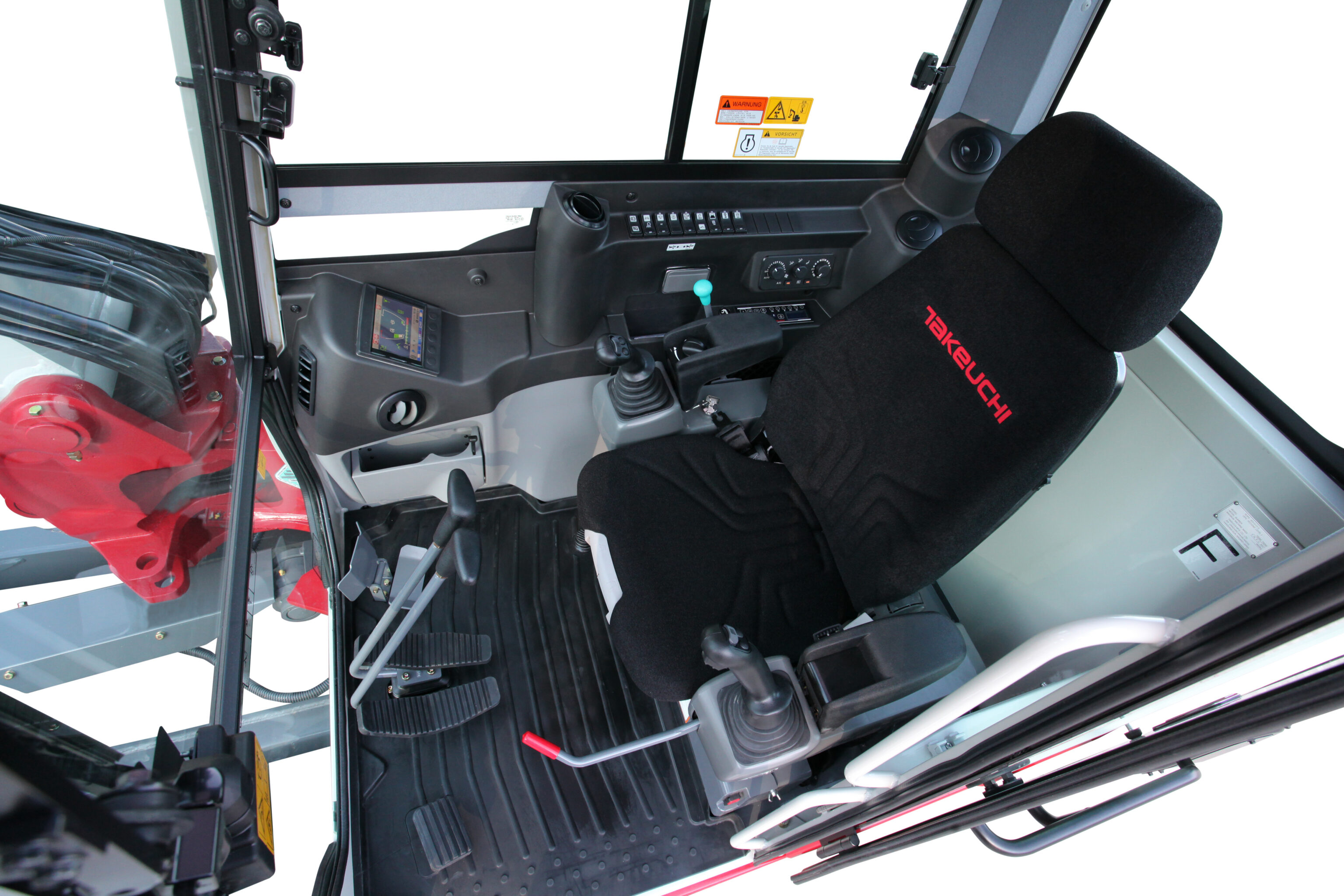 De ruime comfortabele cabine interieur van een Takeuchi TB290-2 midigraver
