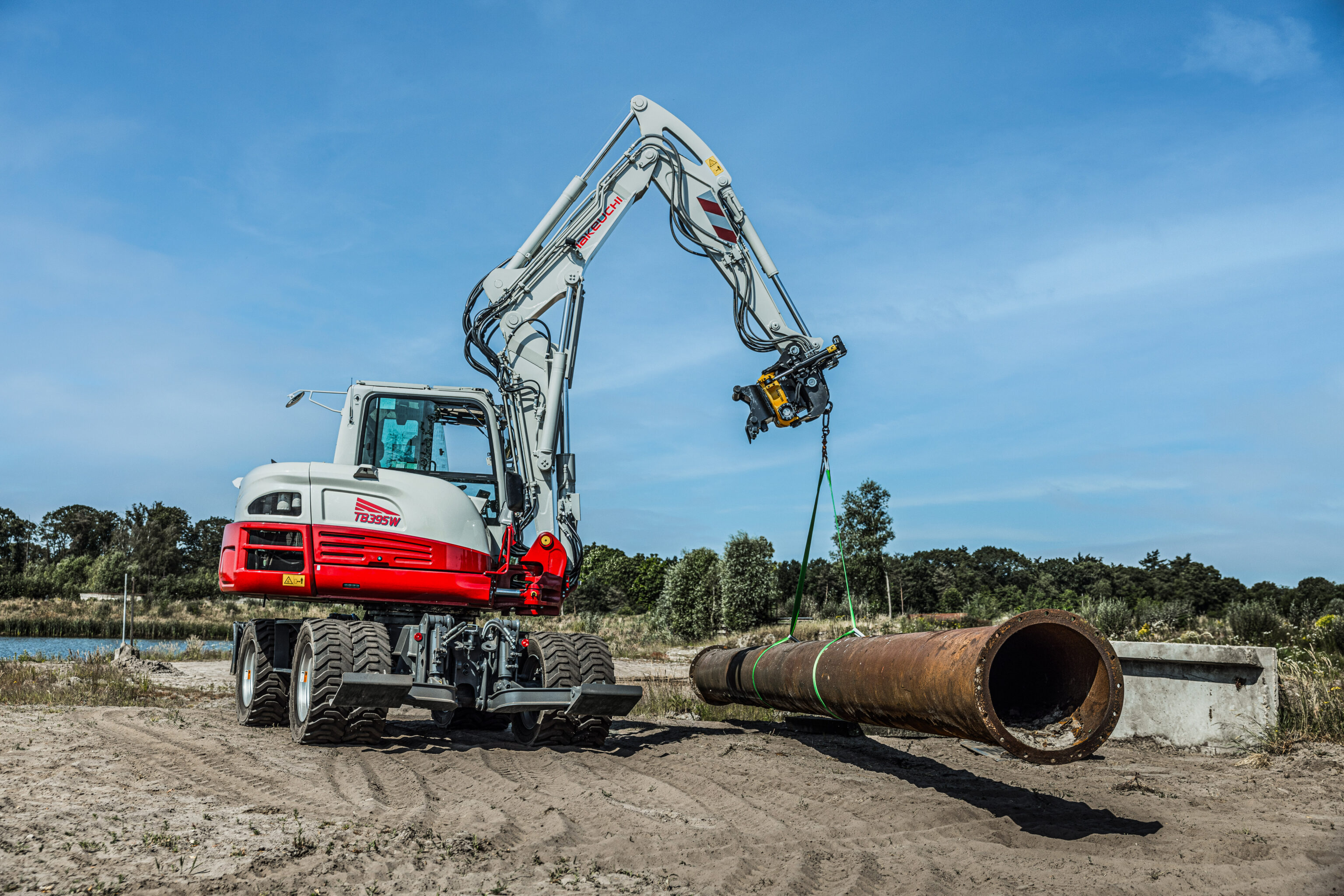 tb395w takeuchi graafmachine tilt een zware metalen buis
